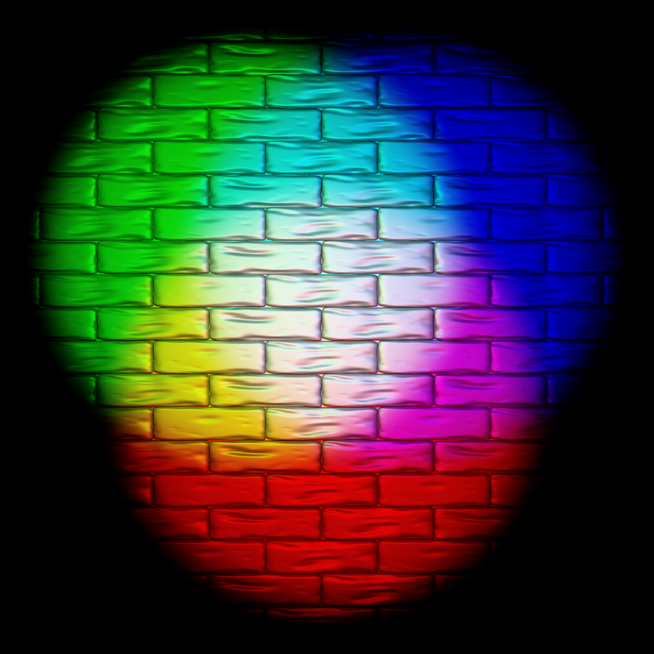 A demonstration of additive colours, three spotlights of red, green, and blue blending into one white patch