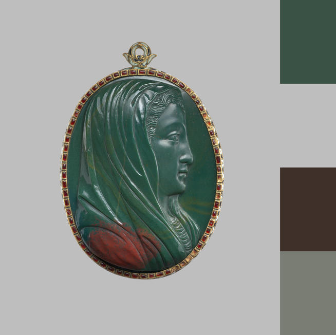 An image of a green pendant on the grey background